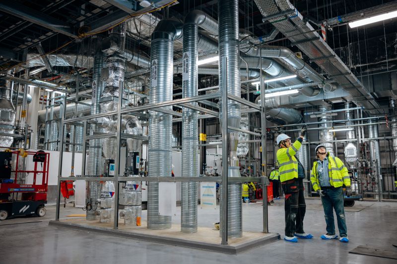 Engineers reviewing technical drawings on site